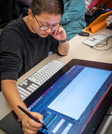 Photo of an animation student working at Interlochen Arts Academy, a filmmaking high school.